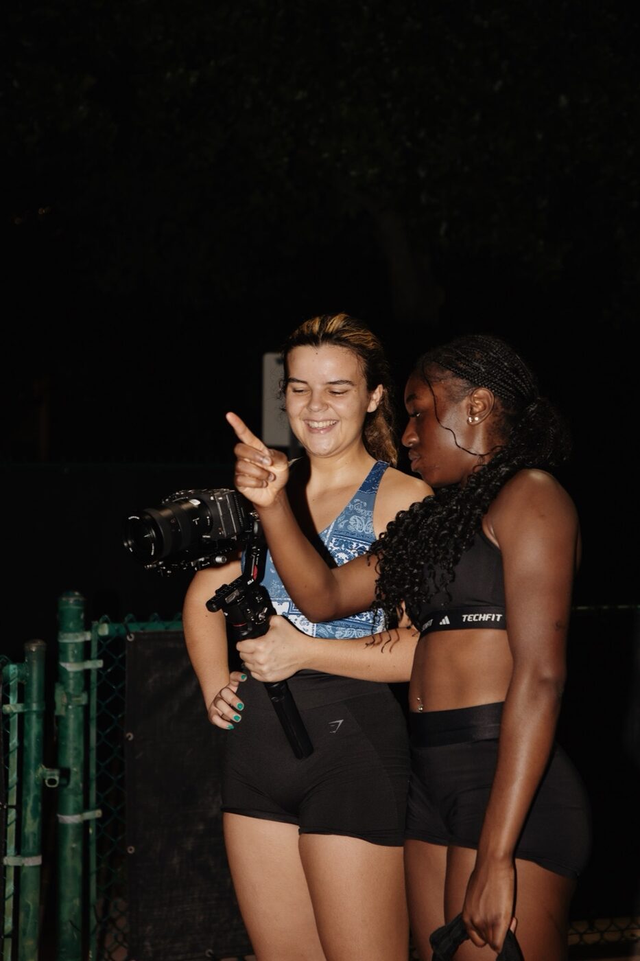 Maya with an athlete after a night shoot